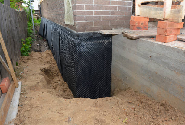 Happy homeowners after waterproofing job in Belmar